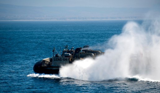 US Navy 111011-N-PB383-380 A Landing craft air cushioned (LCAC) departs the well deck of the amphibious transport dock ship USS New Orleans (LPD 18