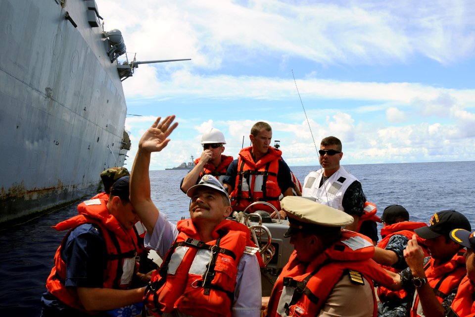 US Navy 111015-N-UE250-328 Distinguished visitors from the Russian Federation navy wave goodbye as they depart the forward deployed Arleigh Burke-c