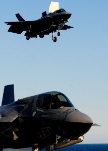 US Navy 111015-N-ZZ999-952 The BF-04, bottom, the Marine Corps variant of the Joint Strike Fighter F-35B Lighting II, maneuvers after a vertical la