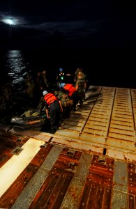 US Navy 111012-N-MW330-719 Sailors assigned to the amphibious dock landing ship USS Germantown (LSD 42) and Marines from the 31st Marine Expedition
