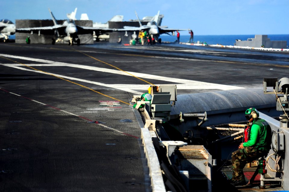 US Navy 111012-N-VN693-246 Sailors prepare for flight operations aboard the aircraft carrier USS John C. Stennis (CVN 74)