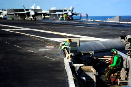 US Navy 111012-N-VN693-246 Sailors prepare for flight operations aboard the aircraft carrier USS John C. Stennis (CVN 74)