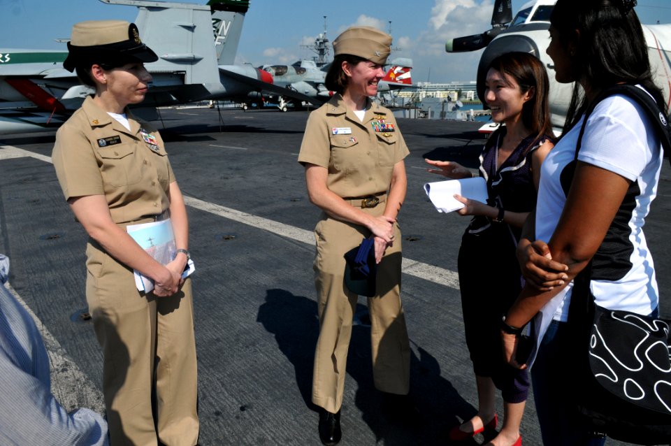US Navy 111015-N-WW409-222 Senior Chief Intelligence Specialist Shannon Shropshire and Capt. Carrie Hasbrouck talk with students from the Singapore