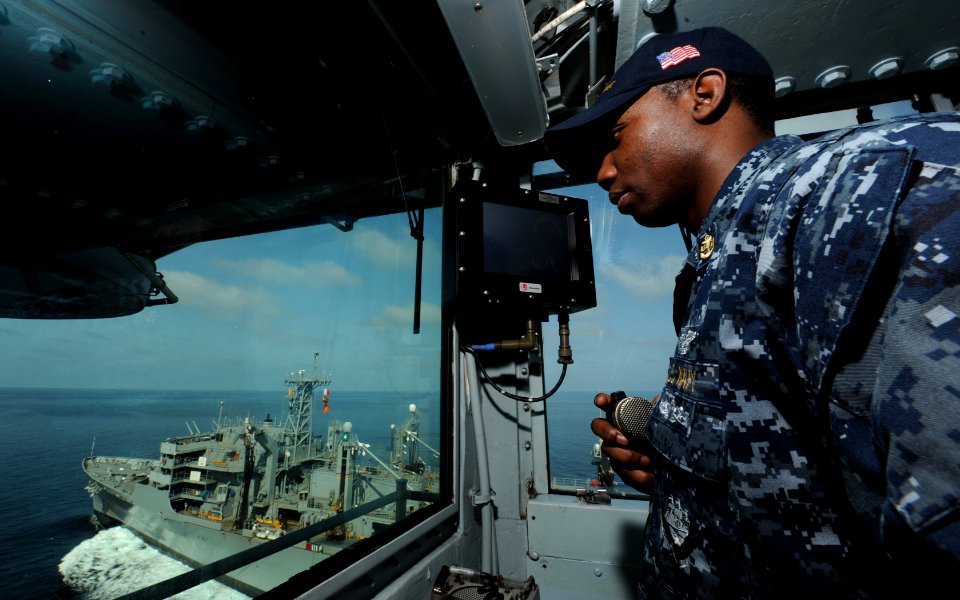 US Navy 111013-N-OY799-029 Chief Aviation Electronics Technician Terrence Rivers, from Wedgefield, S.C., stands watch in the auxiliary conning stat