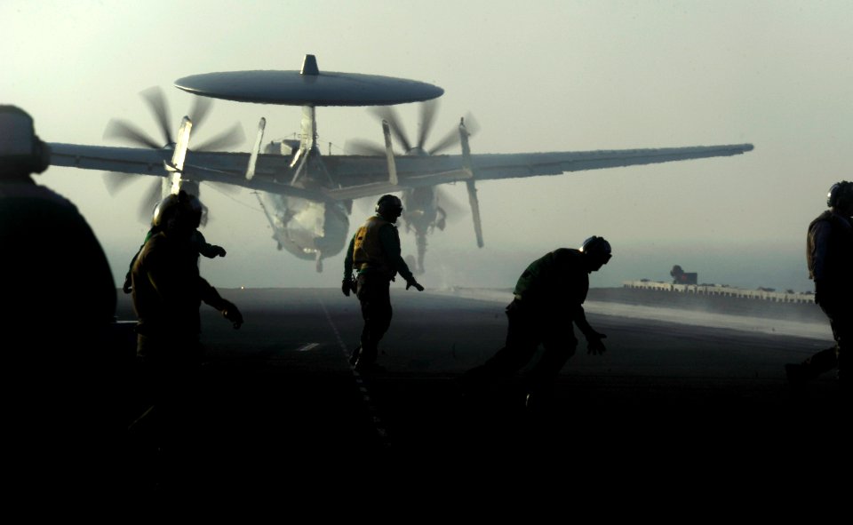 US Navy 111016-N-VN693-127 Aviation boatswain's mates recover after launching an E-2C Hawkeye assigned to the Golden Hawks of Airborne Early Warnin