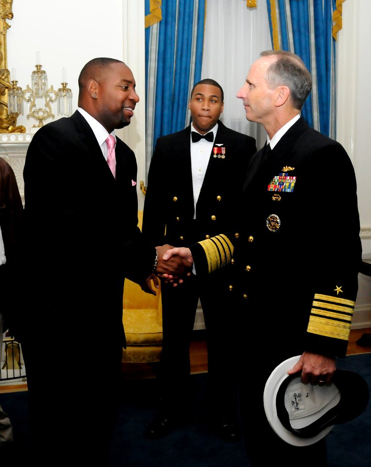 US Navy 111015-N-FC670-250 Chief of Naval Operations (CNO) Adm. Jonathan Greenert meets with Navy veteran and recording artist B. Taylor after the