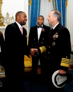 US Navy 111015-N-FC670-250 Chief of Naval Operations (CNO) Adm. Jonathan Greenert meets with Navy veteran and recording artist B. Taylor after the photo