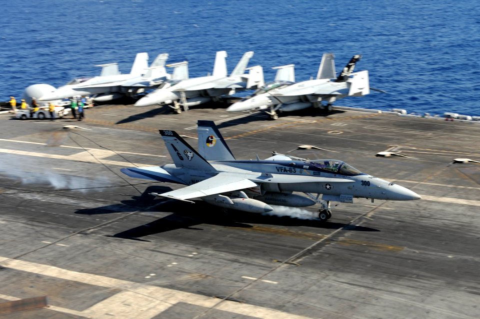 US Navy 111017-N-AU622-100 An F-A-18E Super Hornet assigned to the Rampagers of Strike Fighter Squadron (VFA) 83 lands aboard the aircraft carrier