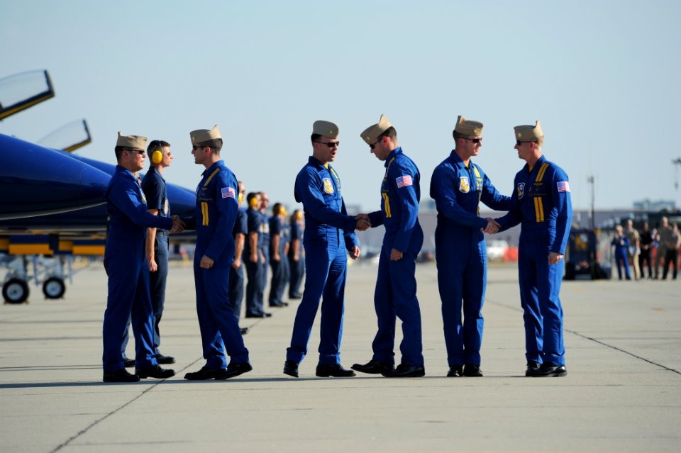 US Navy 111015-N-IR859-051 Pilots assigned to the U.S. Navy flight demonstration squadron, the Blue Angels, greet each other after the demonstratio