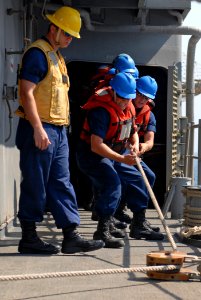 US Navy 111018-N-DU438-061 Sailors heave a line during a connected replenishment aboard the guided-missile cruiser USS Gettysburg (CG 64)