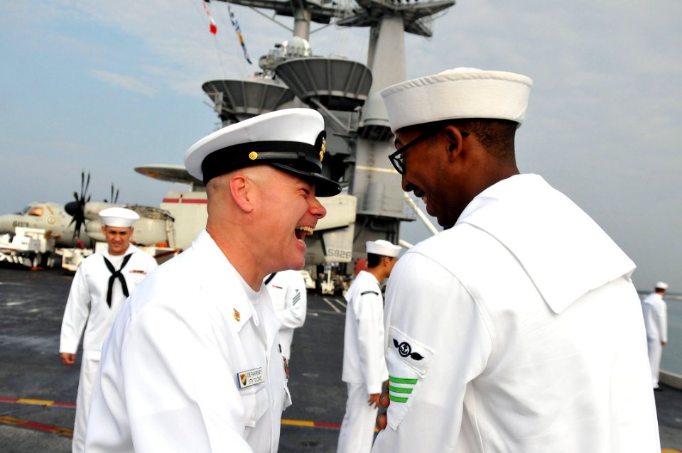 US Navy 111013-N-WW409-101 Command Master Chief Joseph Fahrney, assigned to Commander, Task Force 70, speaks with Sailors as they man the rails abo