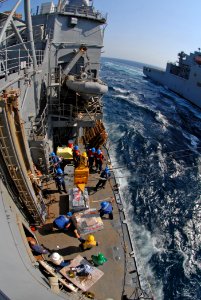 US Navy 111018-N-DU438-699 Sailors receive pallets of stores aboard the guided-missile cruiser USS Gettysburg (CG 64) photo