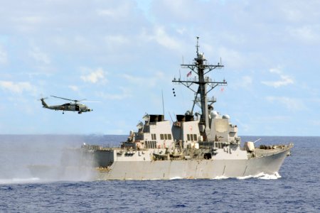 US Navy 111015-N-UE250-401 An SH-60 helicopter takes off from the flight deck of the forward deployed Arleigh Burke-class guided-missile destroyer