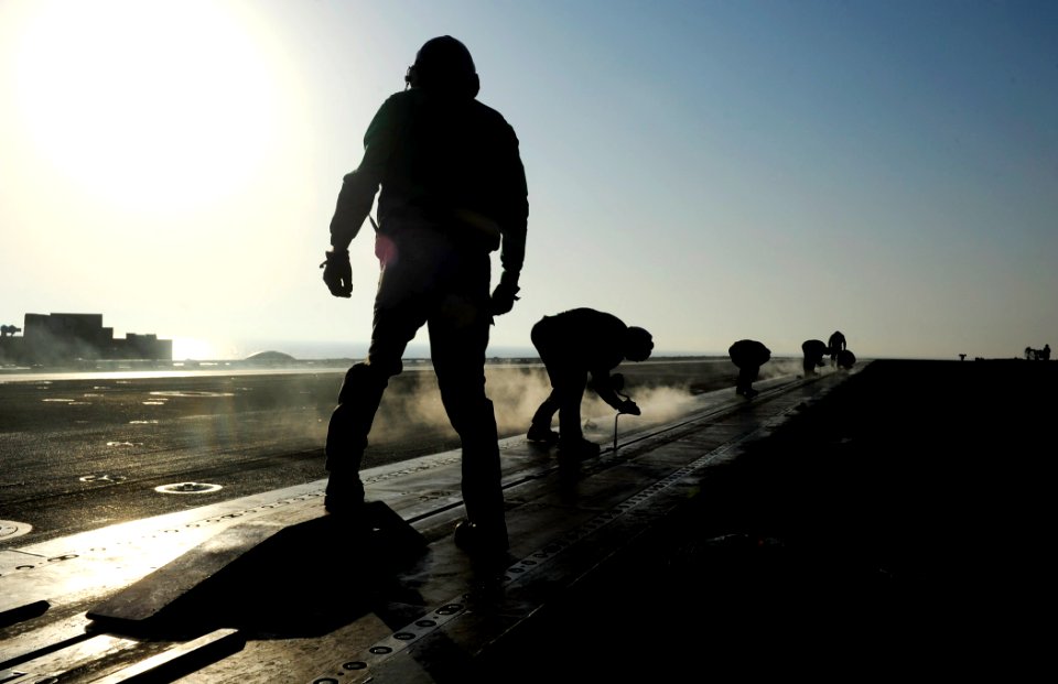 US Navy 111016-N-VN693-060 Aviation boatswain's mates prepare for flight operations aboard the aircraft carrier USS John C. Stennis (CVN 74)