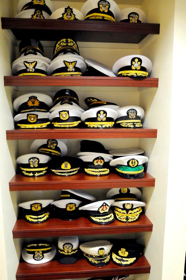 US Navy 111019-N-FC670-024 Senior leaders from International navies stack their covers on a shelf during the 20th International Seapower Symposium