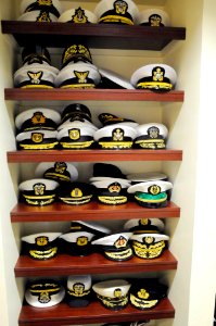 US Navy 111019-N-FC670-024 Senior leaders from International navies stack their covers on a shelf during the 20th International Seapower Symposium
