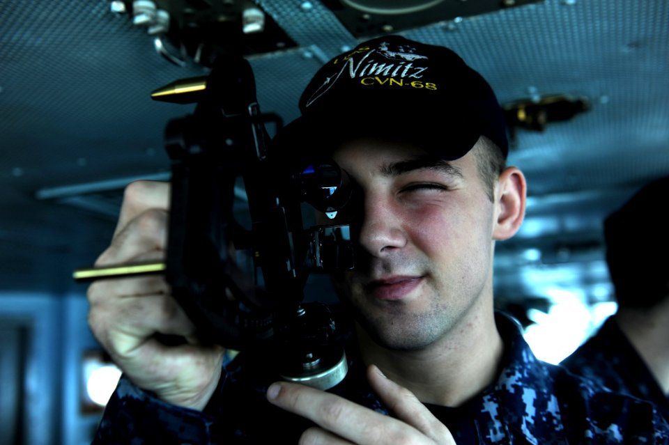US Navy 111020-N-OY799-030 Quartermaster Seaman Tyler Shear, from Grand Rapids, Mich., uses a stadimeter on the bridge aboard the Nimitz-class airc