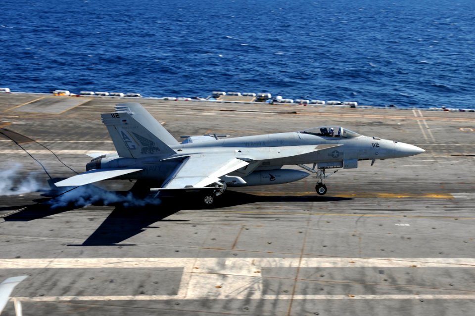 US Navy 111016-N-AU622-048 n F-A-18E Super Hornet assigned to the Pukin Dogs of Strike Fighter Squadron (VFA) 143 catches an arresting wire