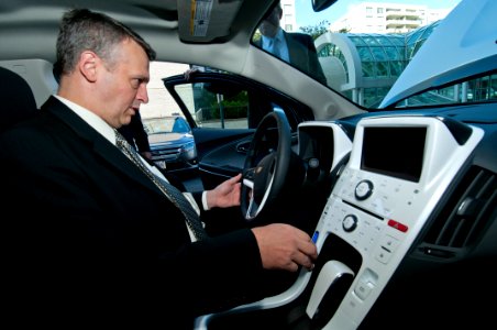 US Navy 111020-N-PM781-010 Tom Hicks, Deputy Assistant Secretary of the Navy for Energy, tests a Chevrolet Volt electric car after accepting the ve