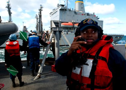 US Navy 111019-N-FI736-216 Operation's Specialist 3rd Class Corneilous Wheaton stands watch as a phonetalker aboard the guided-missile destroyer US