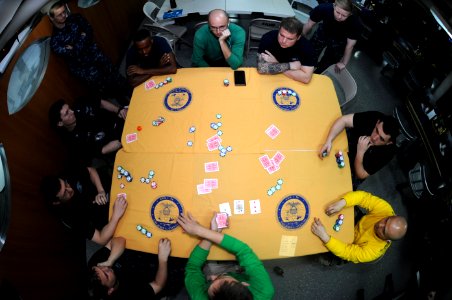 US Navy 111018-N-OY799-003 Sailors participate in a Morale, Welfare and Recreation sponsored poker tournament aboard the Nimitz-class aircraft carr