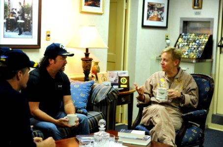 US Navy 111019-N-QL471-054 Rear Adm. Nora W. Tyson, commander of Carrier Strike Group (CSG) 2, right, talks with members of the country music band