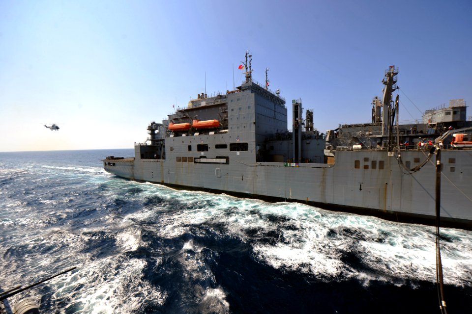 US Navy 111018-N-YZ751-114 Dry cargo-ammunition ship USNS Richard E. Byrd (T-AKE 4) transits alongside guided-missile destroyer USS Truxtun (DDG 10