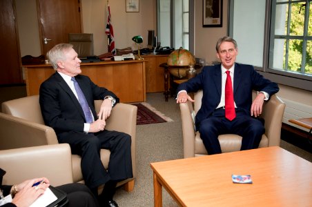US Navy 111021-N-AC887-002 Secretary of the Navy (SECNAV) the Honorable Ray Mabus visits with Britain's Minister of Defense Phillip Hammond