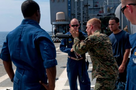 US Navy 111020-N-ER662-268 Marine Sgt. Michael Gesler assigned to the 31st Marine Expeditionary Unit (31rst MEU), Kilo battery division, explains f