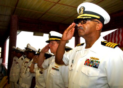 US Navy 111020-N-NJ145-027 U.S. Navy officers salute alongside Royal Cambodian Navy members during opening ceremonies for Cooperation Afloat Readin photo