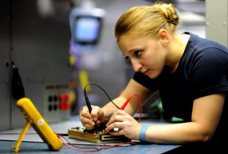 US Navy 111021-N-XE109-186 Aviation Electronics Technician Airman Cristina N. Mace tests resistors on a circuit card aboard the aircraft carrier US photo