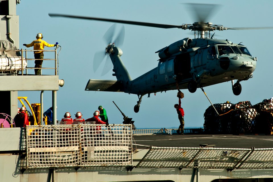 US Navy 111020-N-BT887-421 An MH-60S Sea Hawk assigned to the Eightballers of Helicopter Sea Combat Squadron HSC-8, lifts cargo