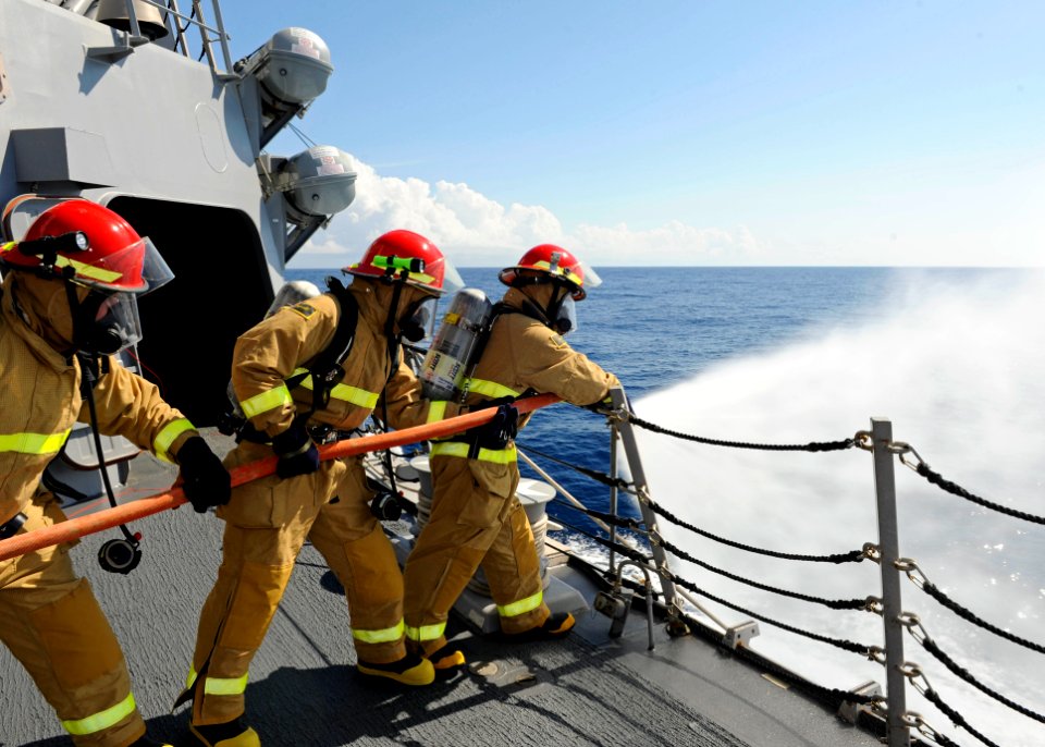 US Navy 111022-N-VH839-031 Sailors aboard the Arleigh Burke-class guided-missile destroyer USS Wayne E. Meyer (DDG 108) discharge a fire hose