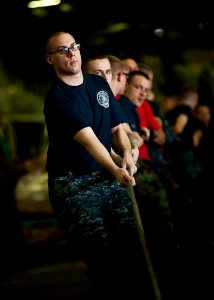 US Navy 111020-N-BT887-357 Sailors heave a line during a replenishment at sea aboard