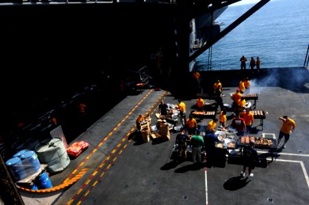 US Navy 111022-N-OY799-038 Chiefs cook on elevator four during a steel beach picnic aboard the Nimitz-class aircraft carrier USS John C. Stennis (C