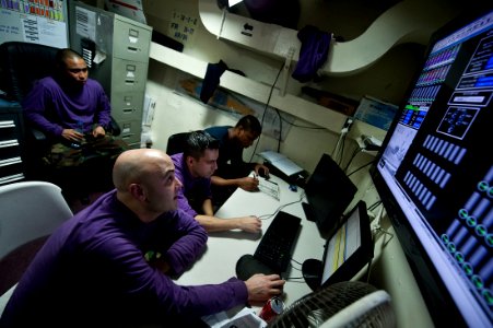 US Navy 111020-N-BT887-512 Aviation boatswain's mates track and record all oncoming fuel during a replenishment at sea