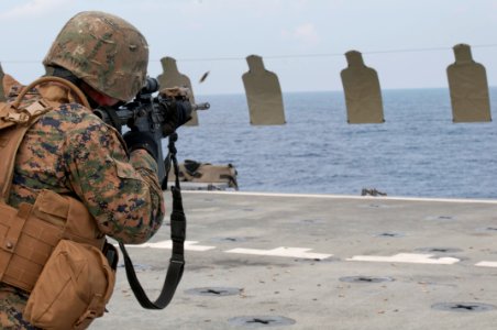 US Navy 111020-N-ER662-327 A Marine assigned to the 31st Marine Expeditionary Unit (31st ME) fires his rifle during a live fire exercise