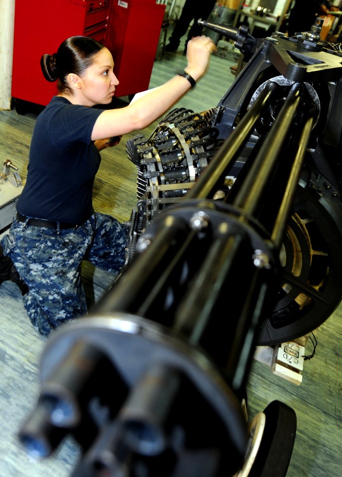 US Navy 111023-N-QL471-080 Aviation Ordnanceman Airman Laticia Workman performs an inspection on an M61A-2 Vulcan 20 mm Gatling gun aboard the airc
