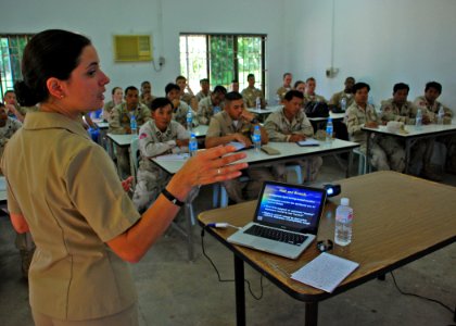 US Navy 111021-N-VP123-243 Lt. Cmdr. Alison Shuler, a judge advocate for Task Force 73, speaks about law of the sea at a symposium during Cooperati photo