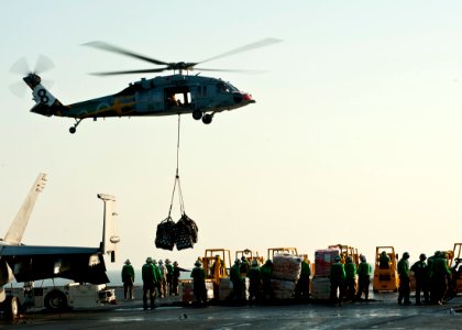 US Navy 111020-N-BT887-272 Sailors participate in a vertical replenishment aboard the Nimitz-class aircraft carrier USS John C. Stennis (CVN 74)