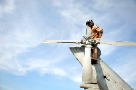 US Navy 111022-N-WW409-193 Lt. John Coombs, assigned to the Warlords of Helicopter Anti-Submarine Squadron Light 51, conducts preflight checks befo