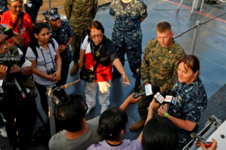 US Navy 111022-N-MW330-034 Cmdr. Carol McKenzie, commanding officer of the amphibious dock landing ship USS Germantown (LSD 42), answers questions
