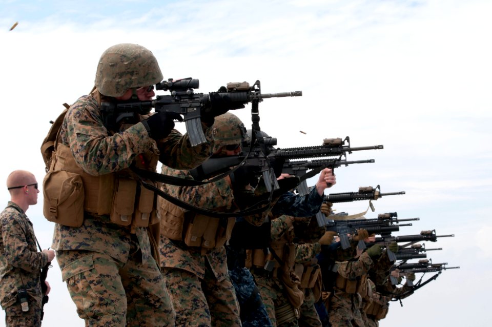 US Navy 111020-N-ER662-307 Marines assigned to the 31st Marine Expeditionary Unit (31st ME) fire their rifles during a live- fire exercise