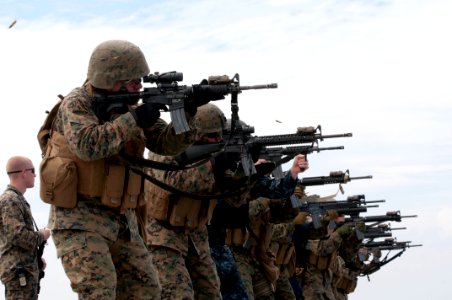 US Navy 111020-N-ER662-307 Marines assigned to the 31st Marine Expeditionary Unit (31st ME) fire their rifles during a live- fire exercise
