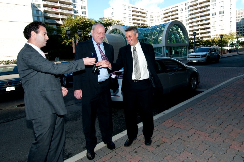 US Navy 111020-N-PM781-007 Tom Hicks, right, Deputy Assistant Secretary of the Navy for Energy, receives the keys to a new Chevrolet Volt electric