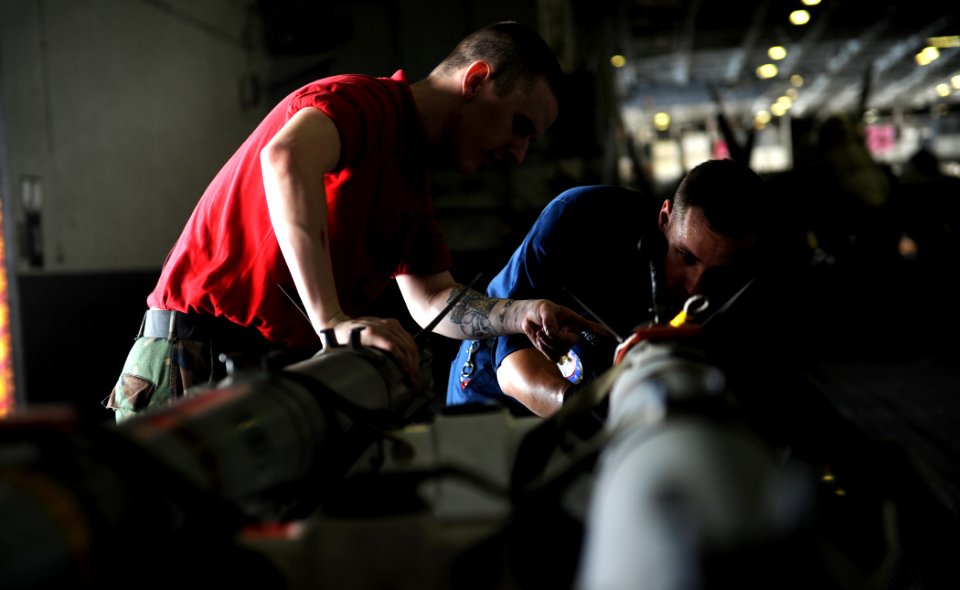 US Navy 111023-N-OY799-026 Aviation Ordnanceman Airman Ryan Dennis, left, from Everett, Wash., and Aviation Ordnanceman 3rd Class Kyle Baber, from
