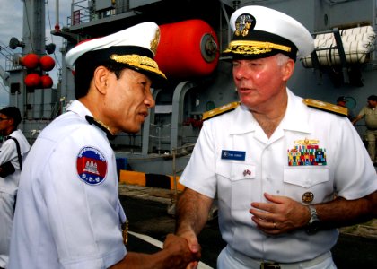US Navy 111020-N-NJ145-140 Royal Cambodian Navy Vice Adm. Ouk Seyha thanks U.S. Navy Rear Adm. Tom Carney, commander of Task Force 73, after tourin