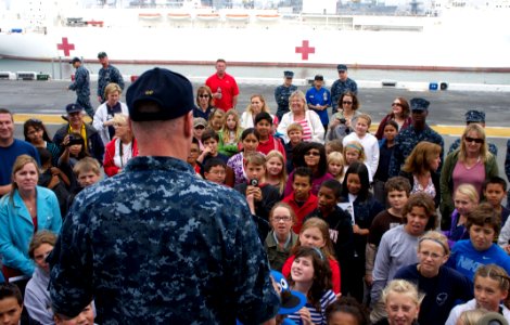 US Navy 111021-N-ZC343-545 Capt. J. L. Harnden, commanding officer of the amphibious assault ship USS Bonhomme Richard (LHD 6), welcomes 5th grader