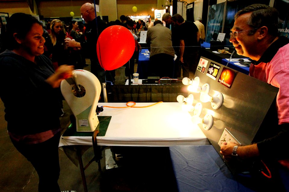 US Navy 111025-N-HW977-797 An 8th grader from Mira Loma Middle School powers lamps with a hand crank