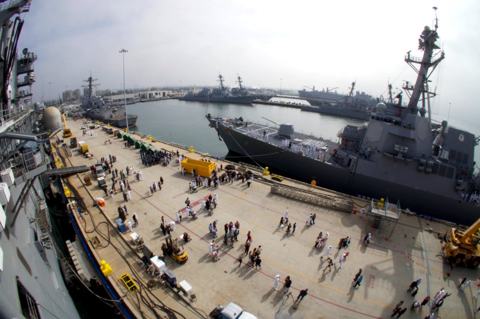 US Navy 111024-N-ZC343-701 Family and friends greet Sailors aboard the guided-missile destroyer USS Spruance (DDG 111) as the ship arrives at its n